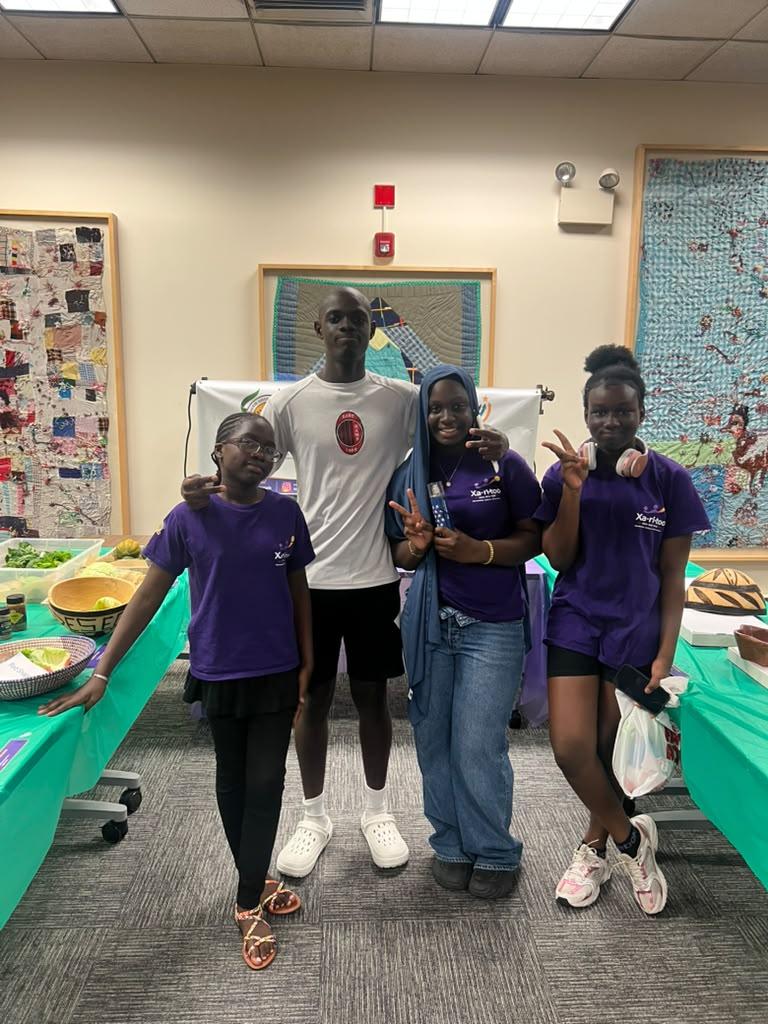 A Xaritoo mentor with mentees at a cultural event