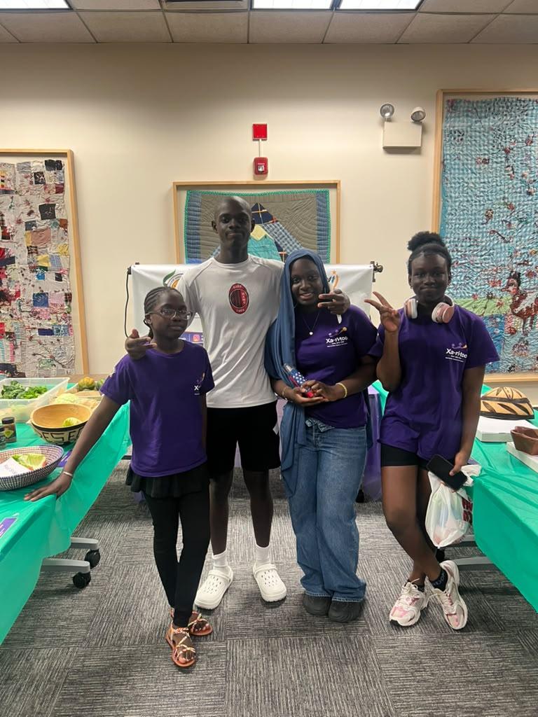 A Xaritoo mentor with mentees during a community gathering
